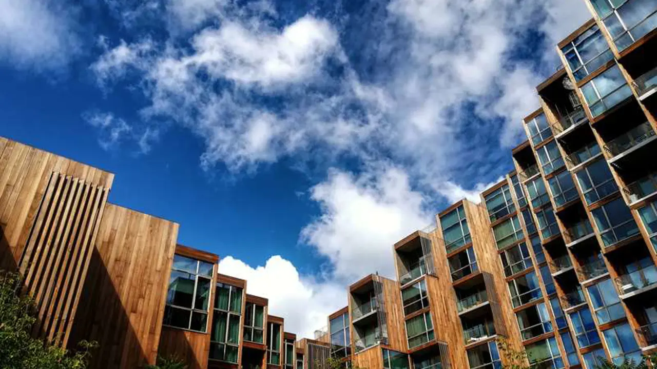cloudy blue sky view from modern wooden buildings