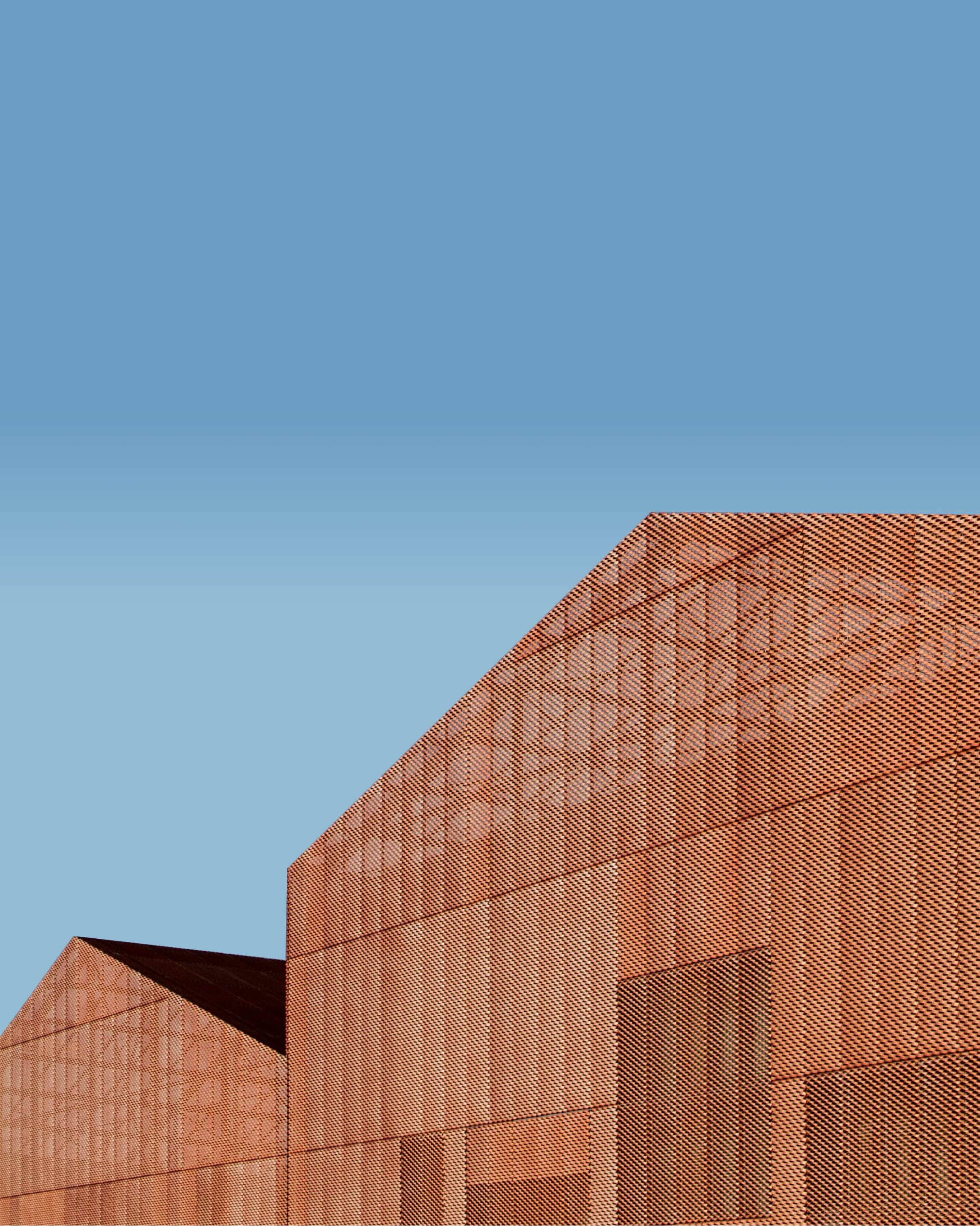 blue sky with a metal building in the foreground