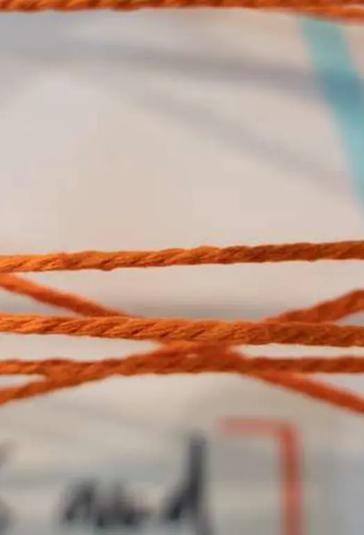close up of orange wool thread
