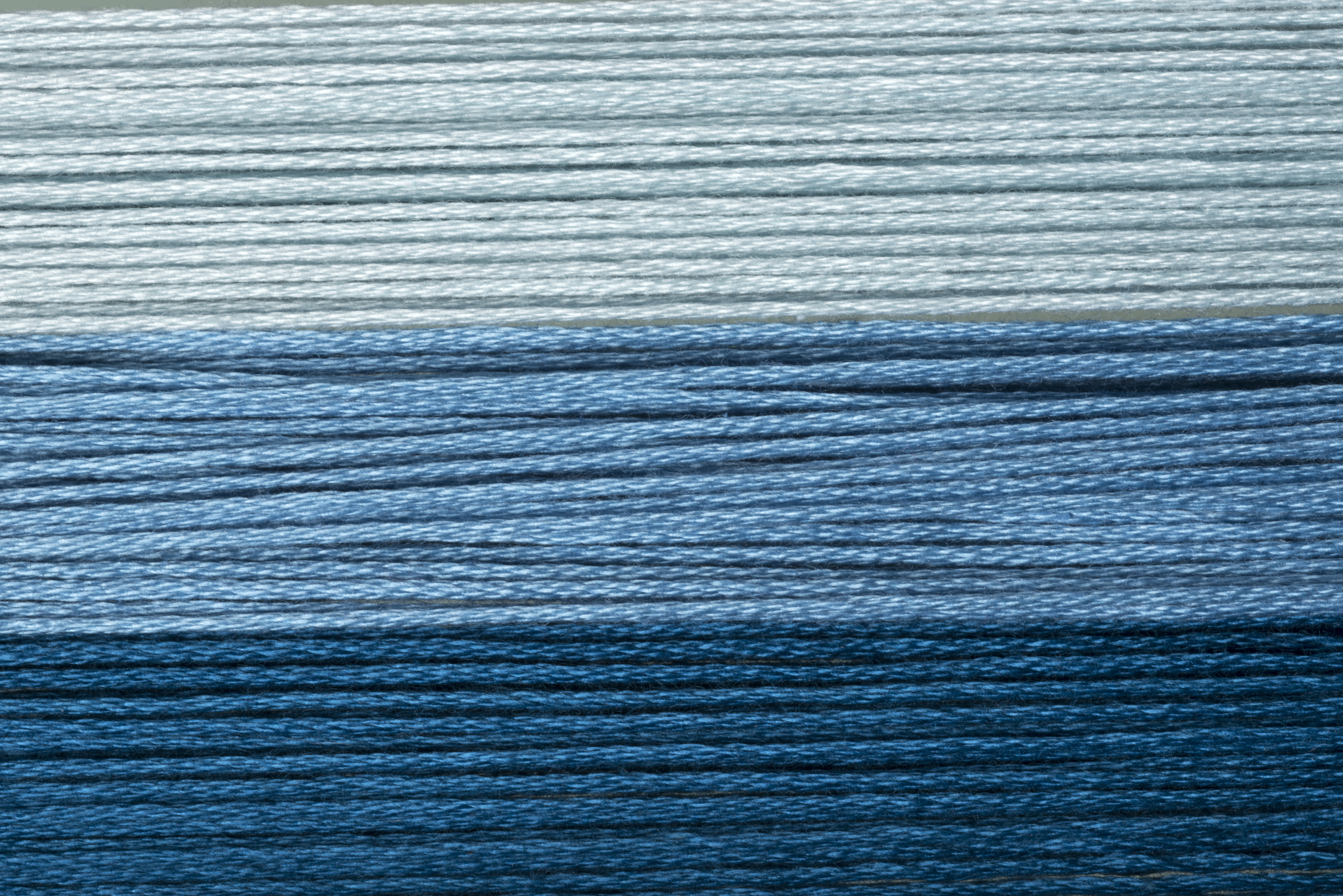 close up of blue wool thread