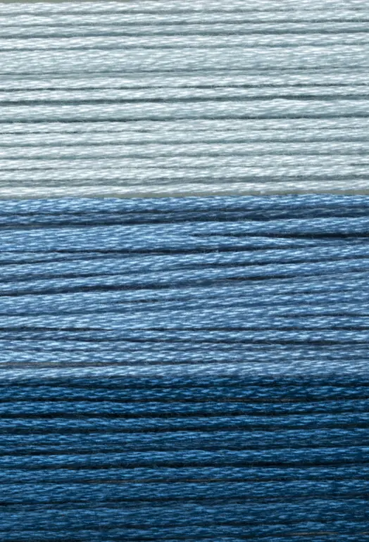 close up of blue wool thread