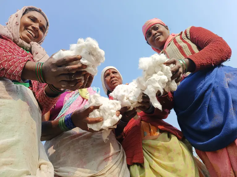 Farmers Showcasing Their Cotton Harvest