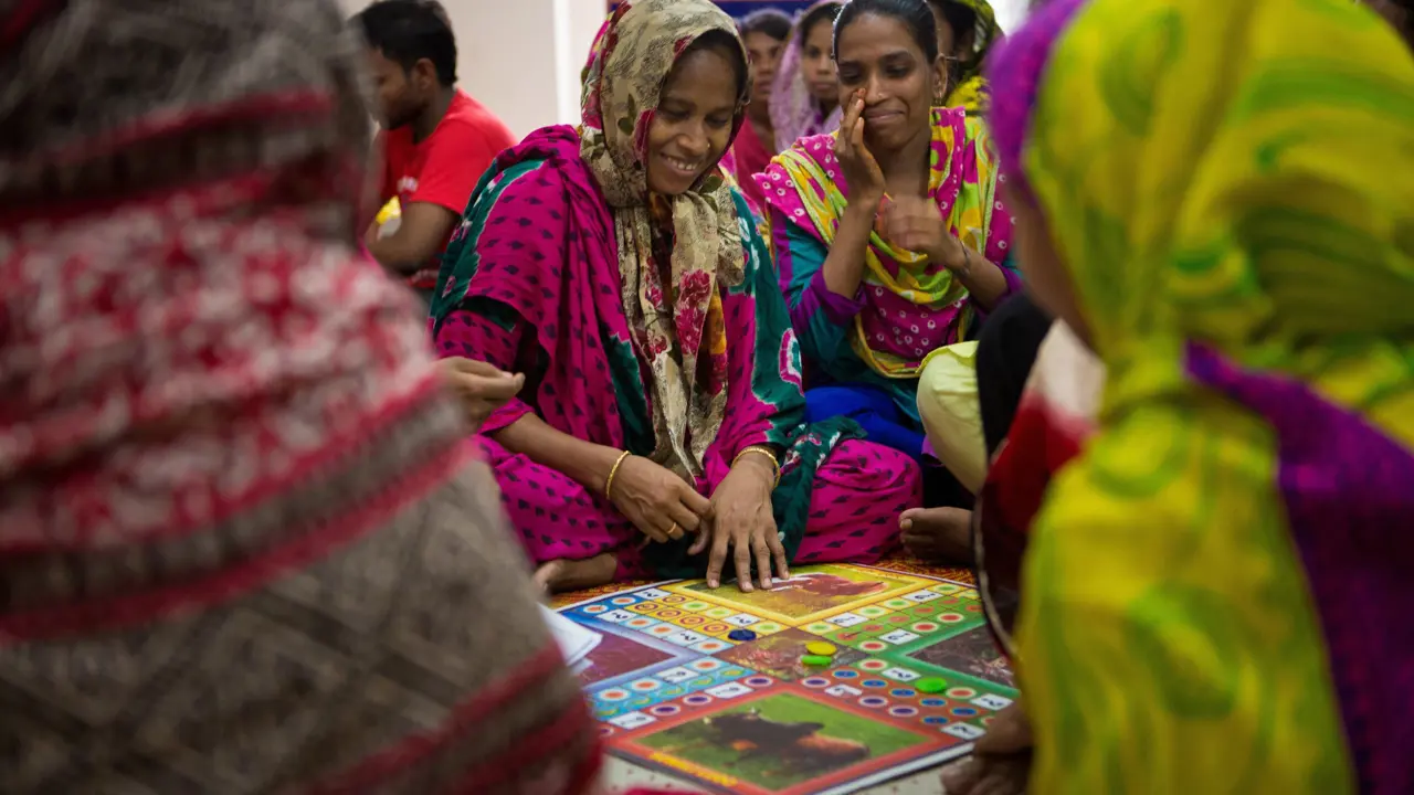 Women enjoying playing a board game