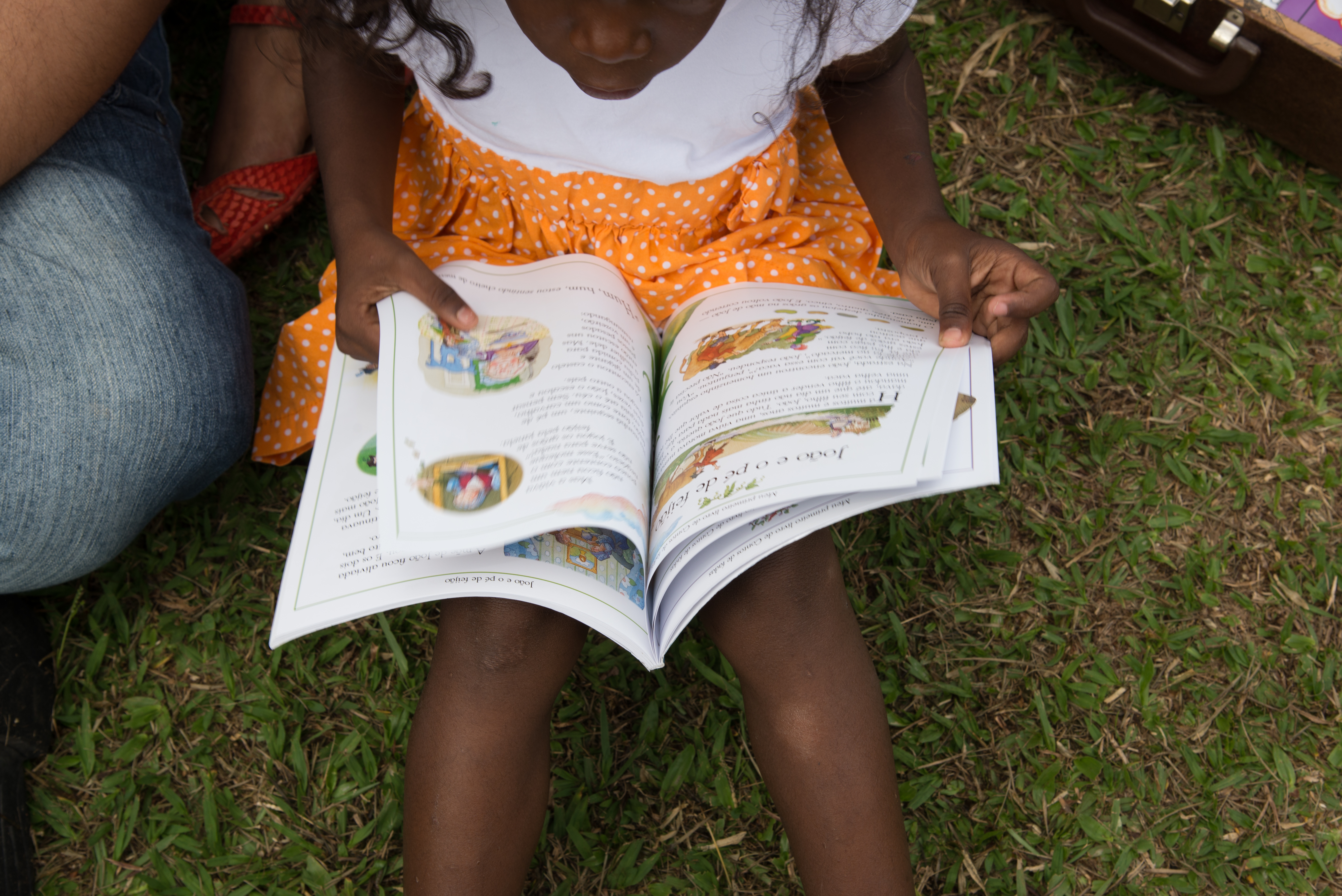 small child reading a book