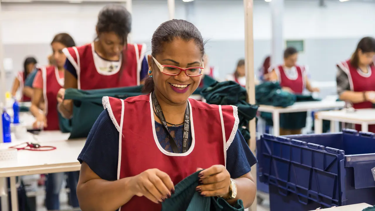 A worker handling fabric